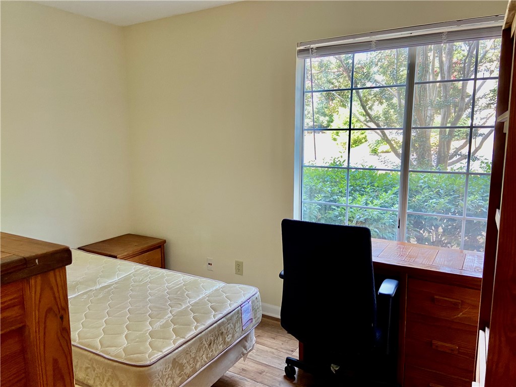 220 Elm Street, Unit 502 Clemson, SC 29631 - Photo 14 of 20 This versatile room features warm flooring and a sunlit window, ready for personalization.