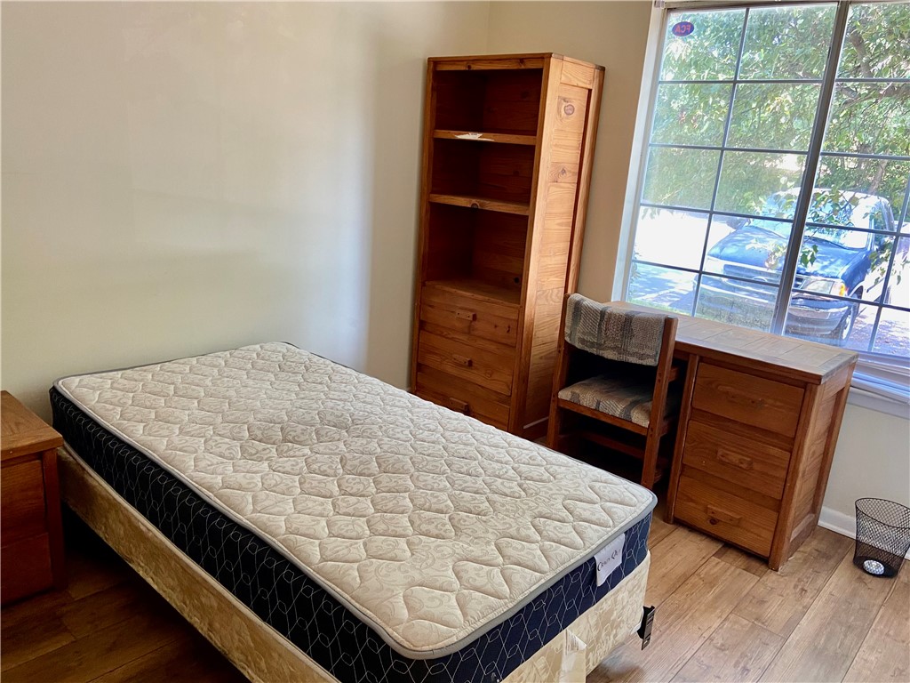 220 Elm Street, Unit 502 Clemson, SC 29631 - Photo 15 of 20 This cozy bedroom features durable hardwood flooring and a large window.