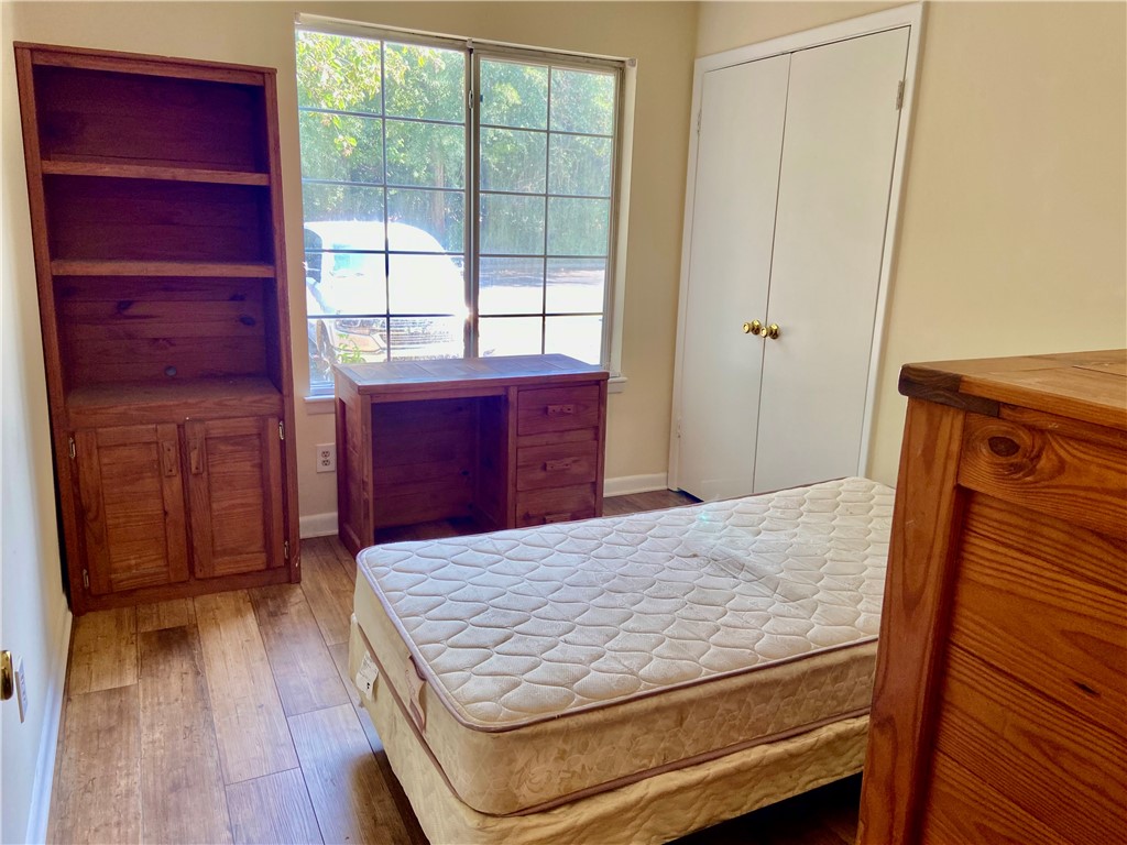 220 Elm Street, Unit 502 Clemson, SC 29631 - Photo 16 of 20 This spacious room features ample natural light and durable flooring, offering a comfortable living space.