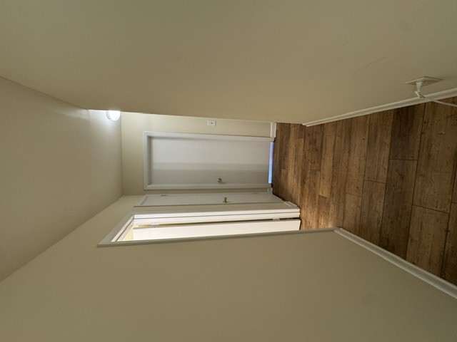 220 Elm Street, Unit 502 Clemson, SC 29631 - Photo 19 of 20 This interior hallway features warm flooring and classic white doors.