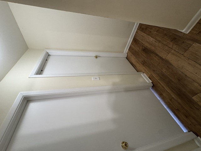 220 Elm Street, Unit 502 Clemson, SC 29631 - Photo 20 of 20 This interior hallway features classic hardwood flooring and white paneled doors.