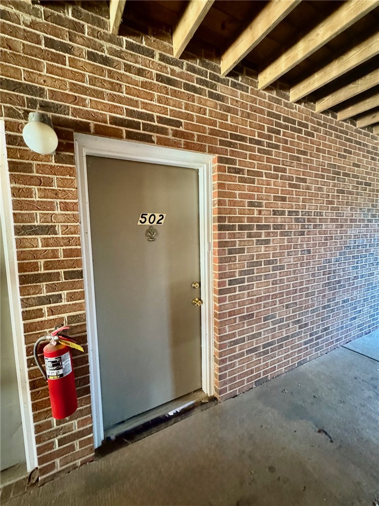 220 Elm Street, Unit 502 Clemson, SC 29631 - Photo 3 of 17 This entry boasts a classic brick exterior, offering a durable and timeless aesthetic.