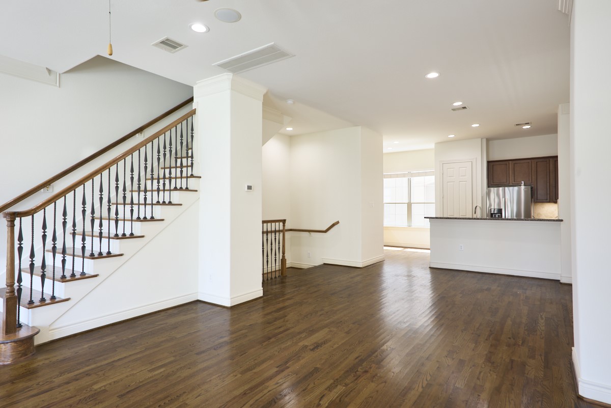 1026 Wagner Street Houston, TX 77007 - Photo 11 of 33 an empty room with wooden floor and windows