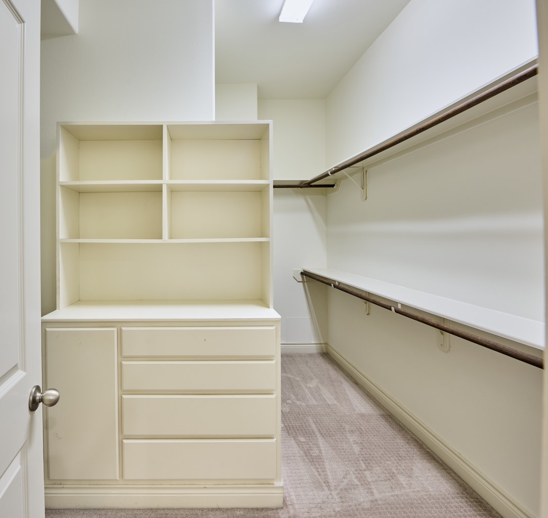 1026 Wagner Street Houston, TX 77007 - Photo 24 of 33 a view of walk in closet with empty racks