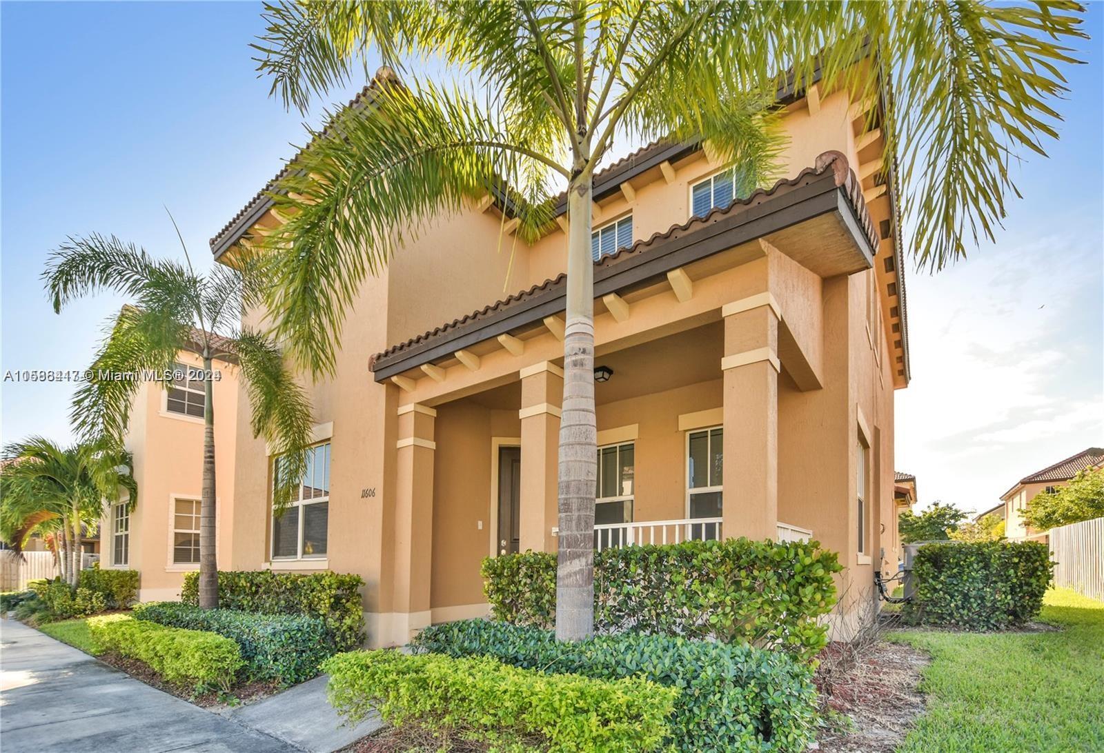 a view of a building with a palm tree