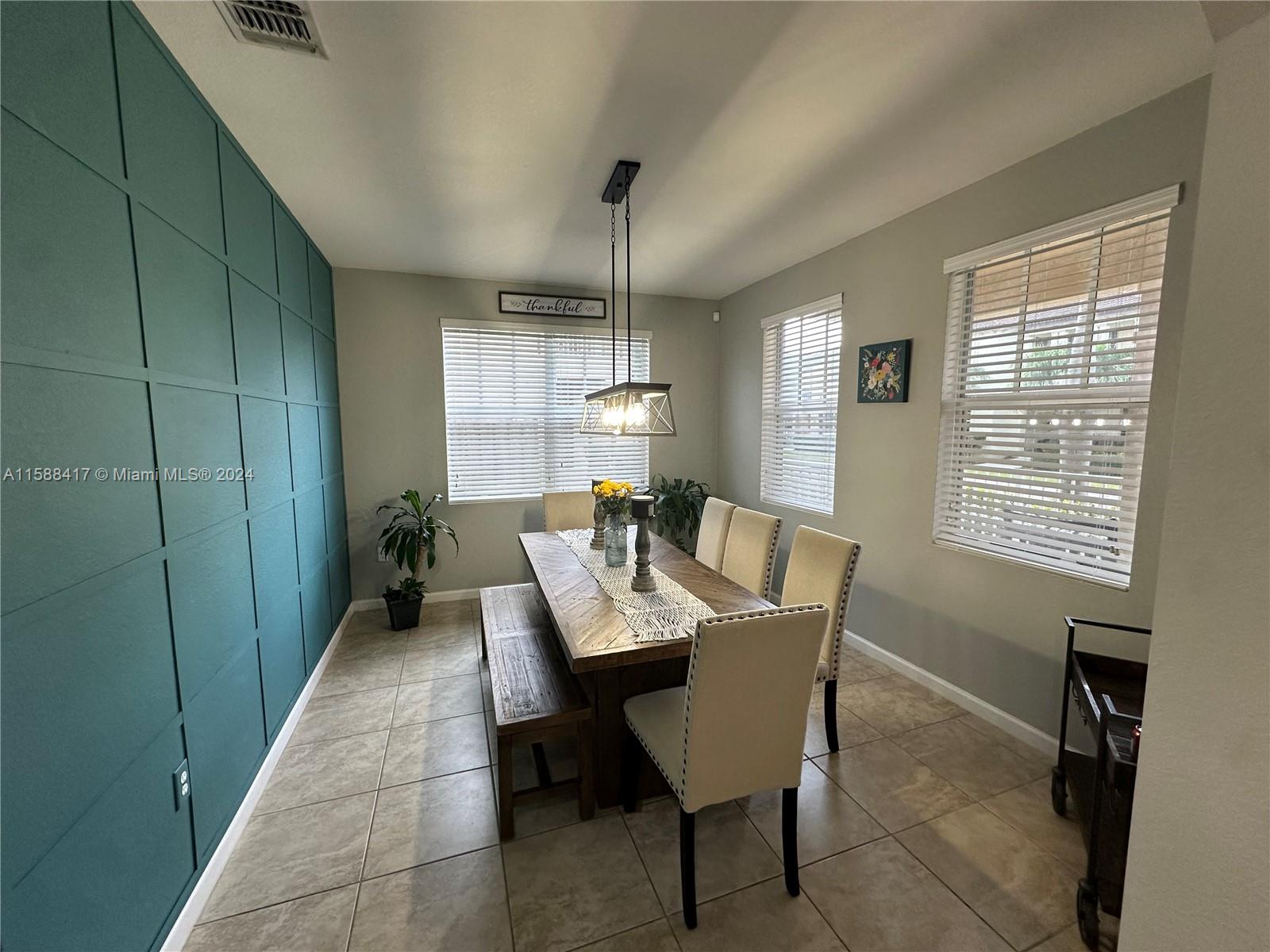 11606 Southwest 245 Terrace Homestead, FL 33032 - Photo 7 of 27 a dining room with furniture and window