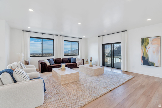 3918 South Mapleton Ests Drive Mapleton, UT 84664 - Photo 48 of 103 Living room featuring light wood-style flooring, recessed lighting, and a mountain view