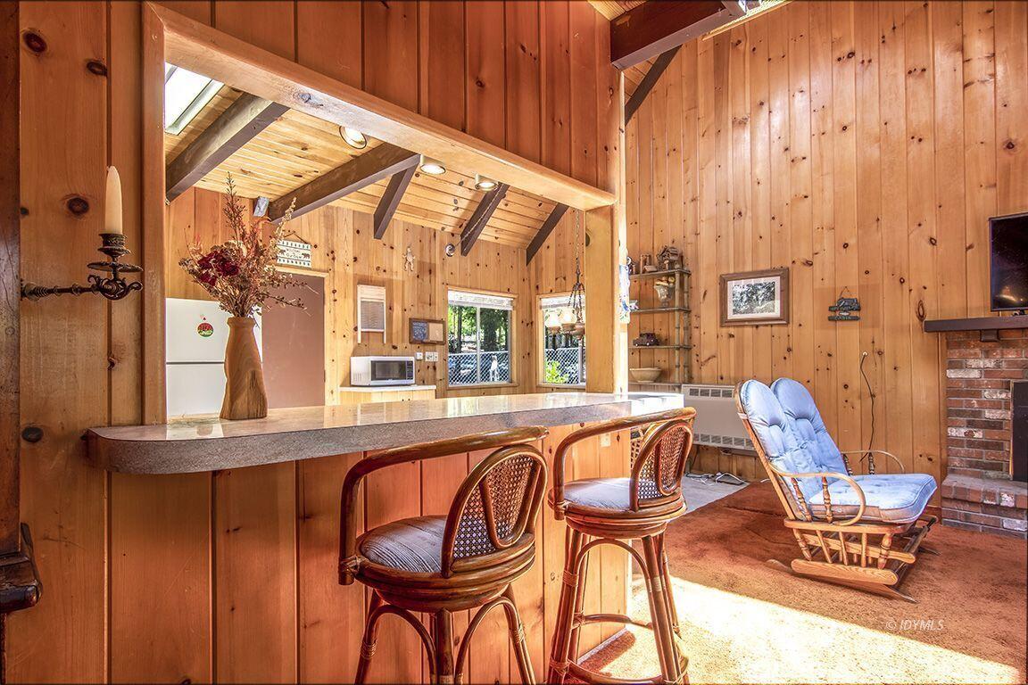 25075 Wood Road Idyllwild, CA 92549 - Photo 11 of 21 a view of a chairs and table in the balcony