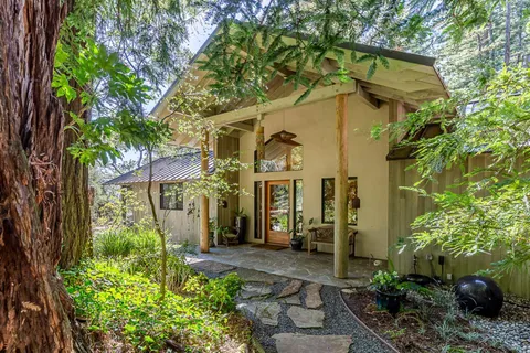 a view of a house with a tree