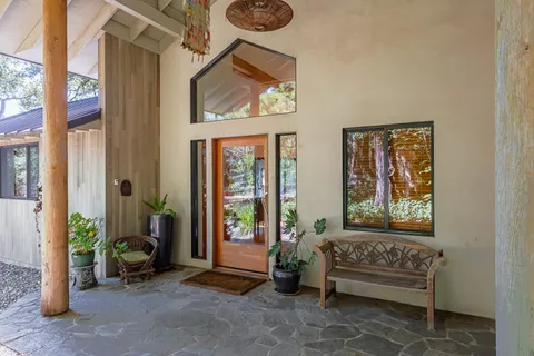 a view of a livingroom with furniture and windows