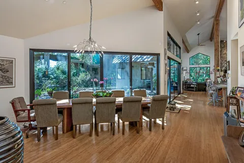 a view of a dining room with furniture window and outside view