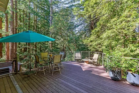 an outdoor space with furniture and umbrella