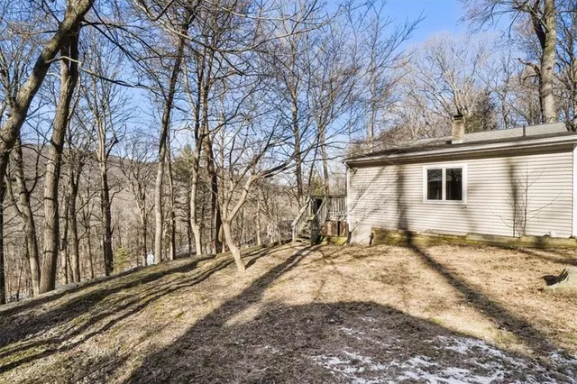 a view of a yard with snow on the road