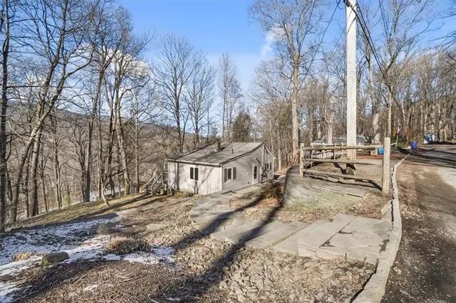 a view of a yard with snow on the road