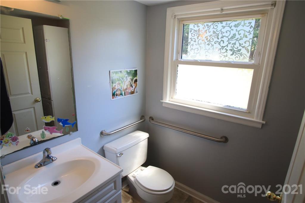 433 Willow Road Salisbury, NC 28147 - Photo 29 of 34 a bathroom with a sink a toilet and a window