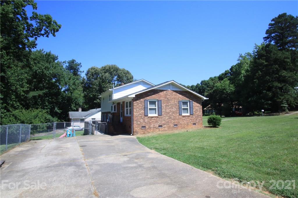 433 Willow Road Salisbury, NC 28147 - Photo 30 of 34 a view of a house with yard and a garden