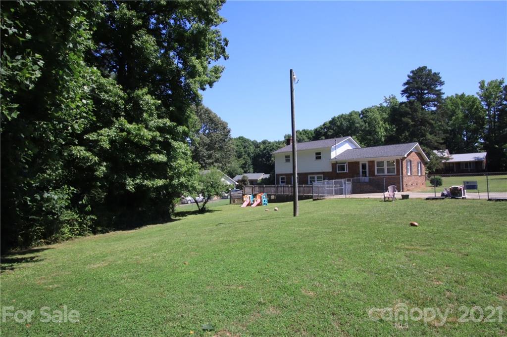 433 Willow Road Salisbury, NC 28147 - Photo 33 of 34 a view of a house with a backyard and a tree