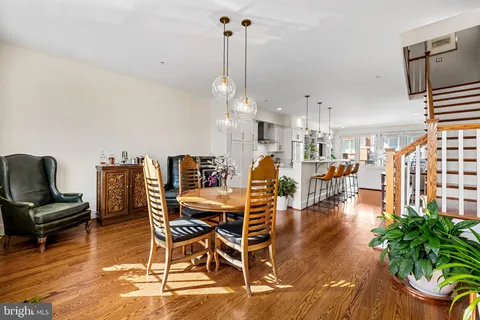 a bedroom with bed and wooden floor