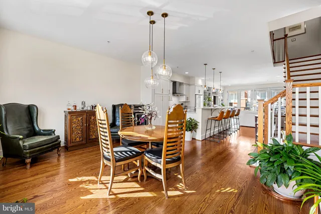 a bedroom with bed and wooden floor