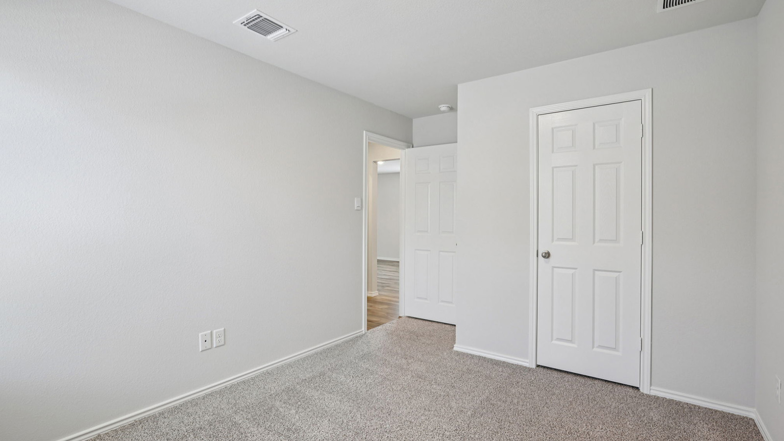 156 Wyatt Way Jarrell, TX 76537 - Photo 25 of 30 Light grey wall paint and light grey carpet