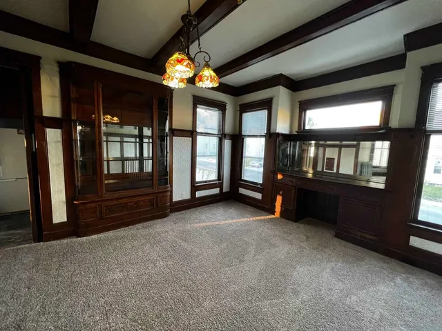 a view of an empty room and window