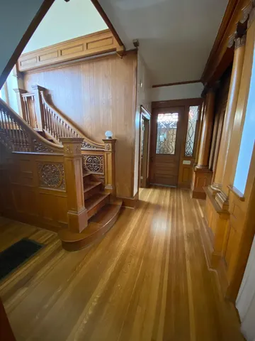 a view of an entryway with wooden floor