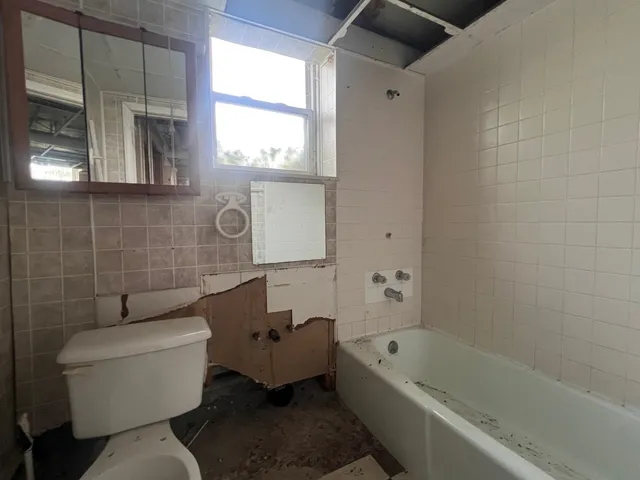 a bathroom with a toilet sink and bathtub