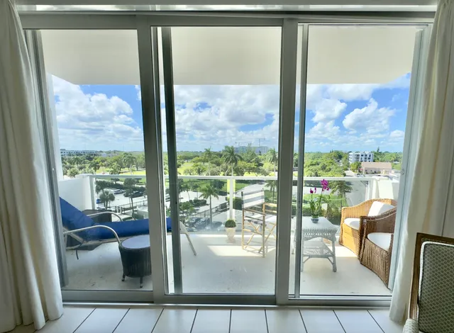 a view of a room and a floor to ceiling window