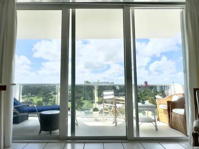 a view of a room with a bed