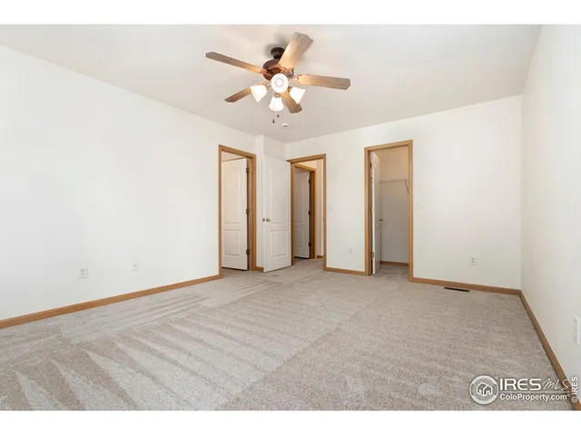 a view of a livingroom with a chandelier fan