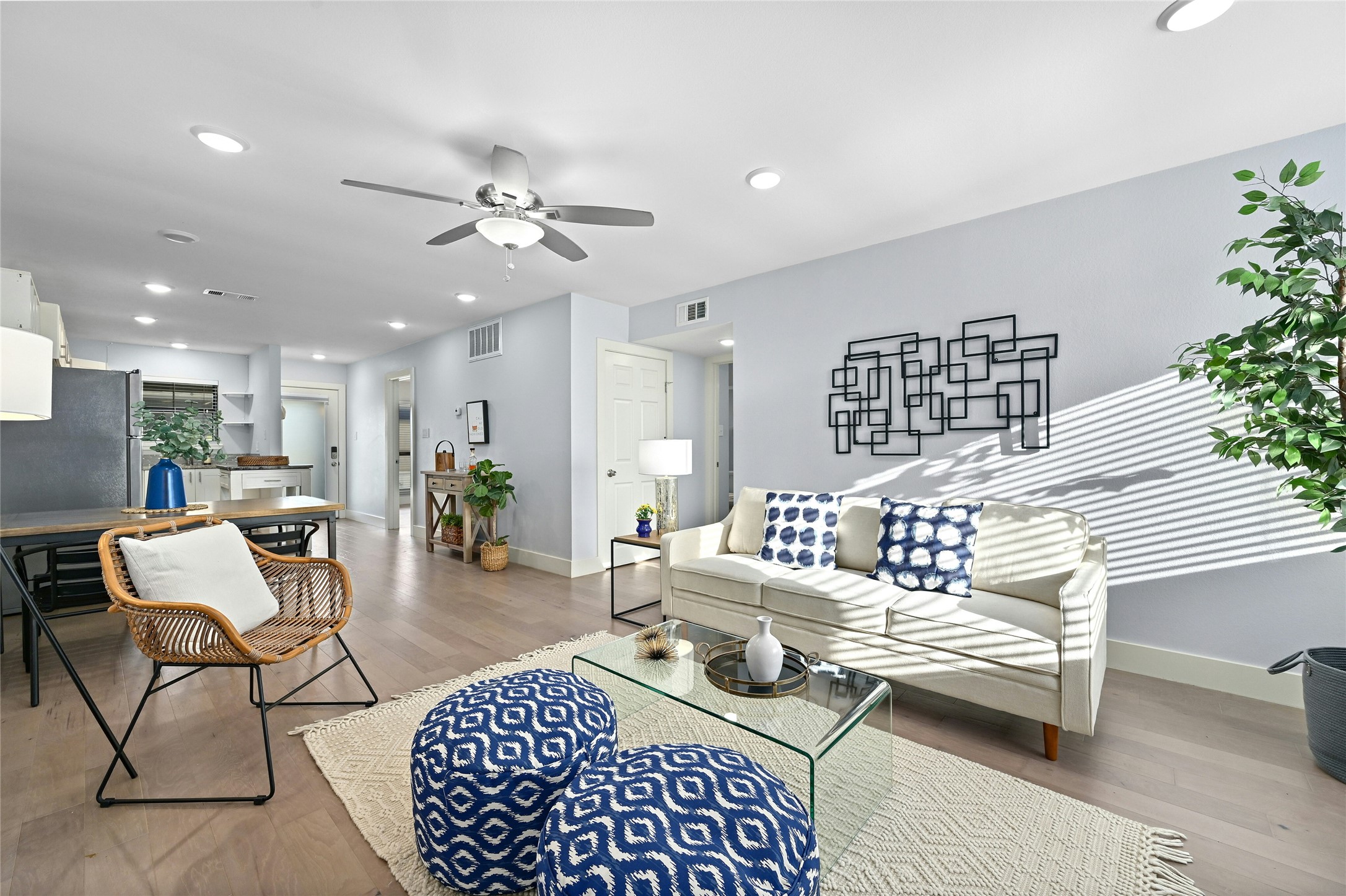 909 Reinli Street, Unit 228 Austin, TX 78751 - Photo 11 of 27 a living room with furniture and a chandelier