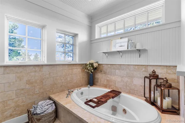 a bathroom with a sink a toilet and a window