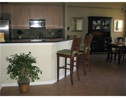a kitchen with a table and chairs in it