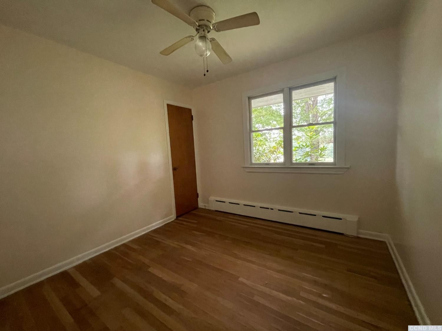 14 Cairo Junction Road Catskill, NY 12451 - Photo 10 of 25 a view of an empty room with wooden floor and a window