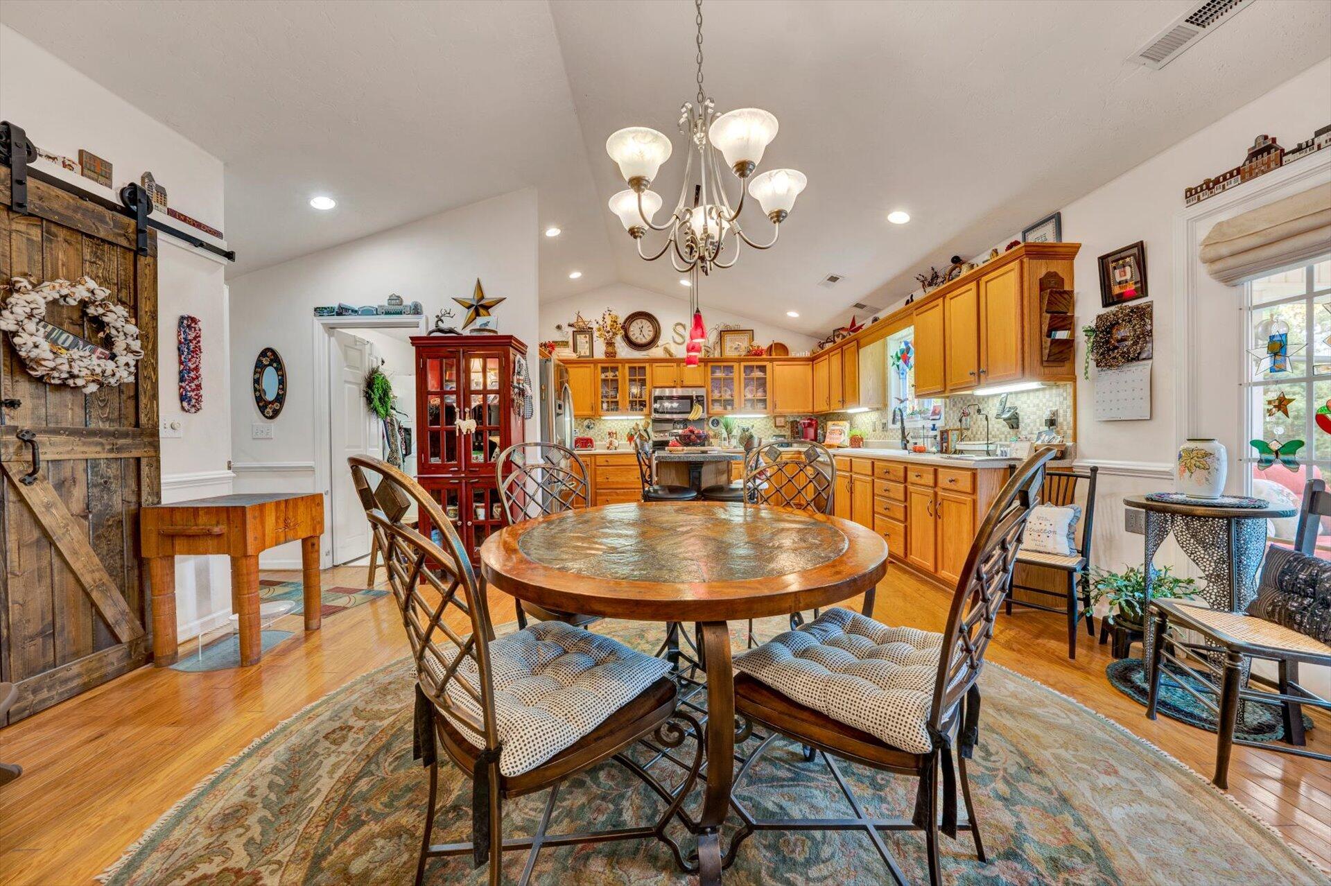 4316 Cove Road Roanoke, VA 24017 - Photo 9 of 31 a view of a dining room with furniture and wooden floor