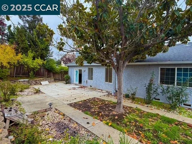 a house with trees in front of it