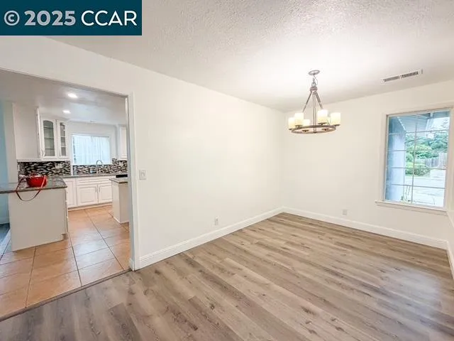 a view of kitchen view with wooden floor and kitchen space