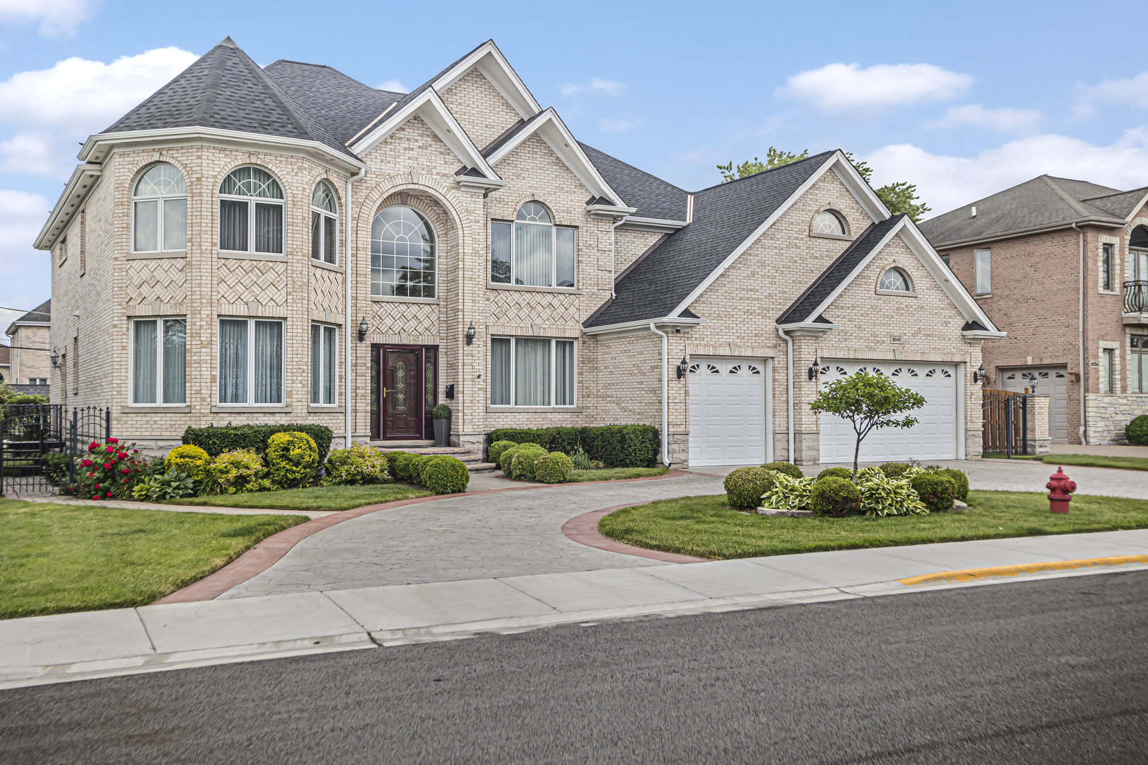 8040 West Charmaine Road Norridge, IL 60706 - Photo 1 of 62 a front view of a house with garden