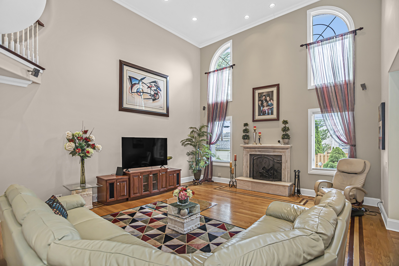 8040 West Charmaine Road Norridge, IL 60706 - Photo 14 of 62 a living room with furniture flat screen tv and a fireplace
