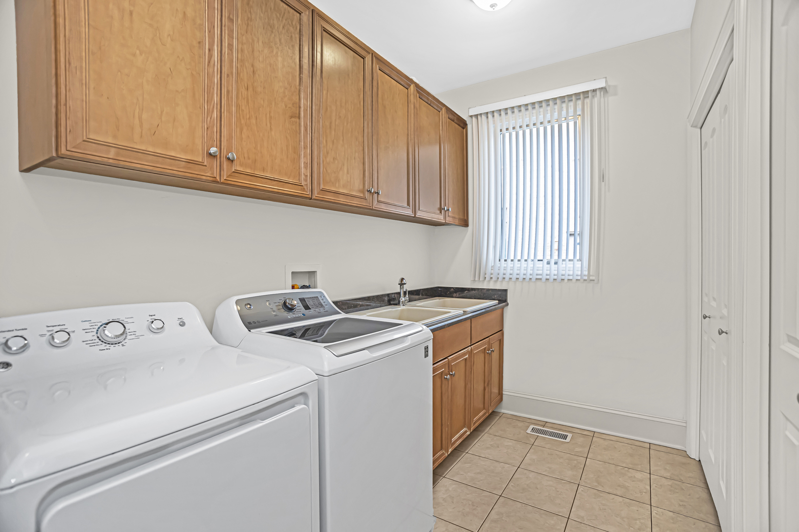 8040 West Charmaine Road Norridge, IL 60706 - Photo 21 of 62 a utility room with dryer and washer
