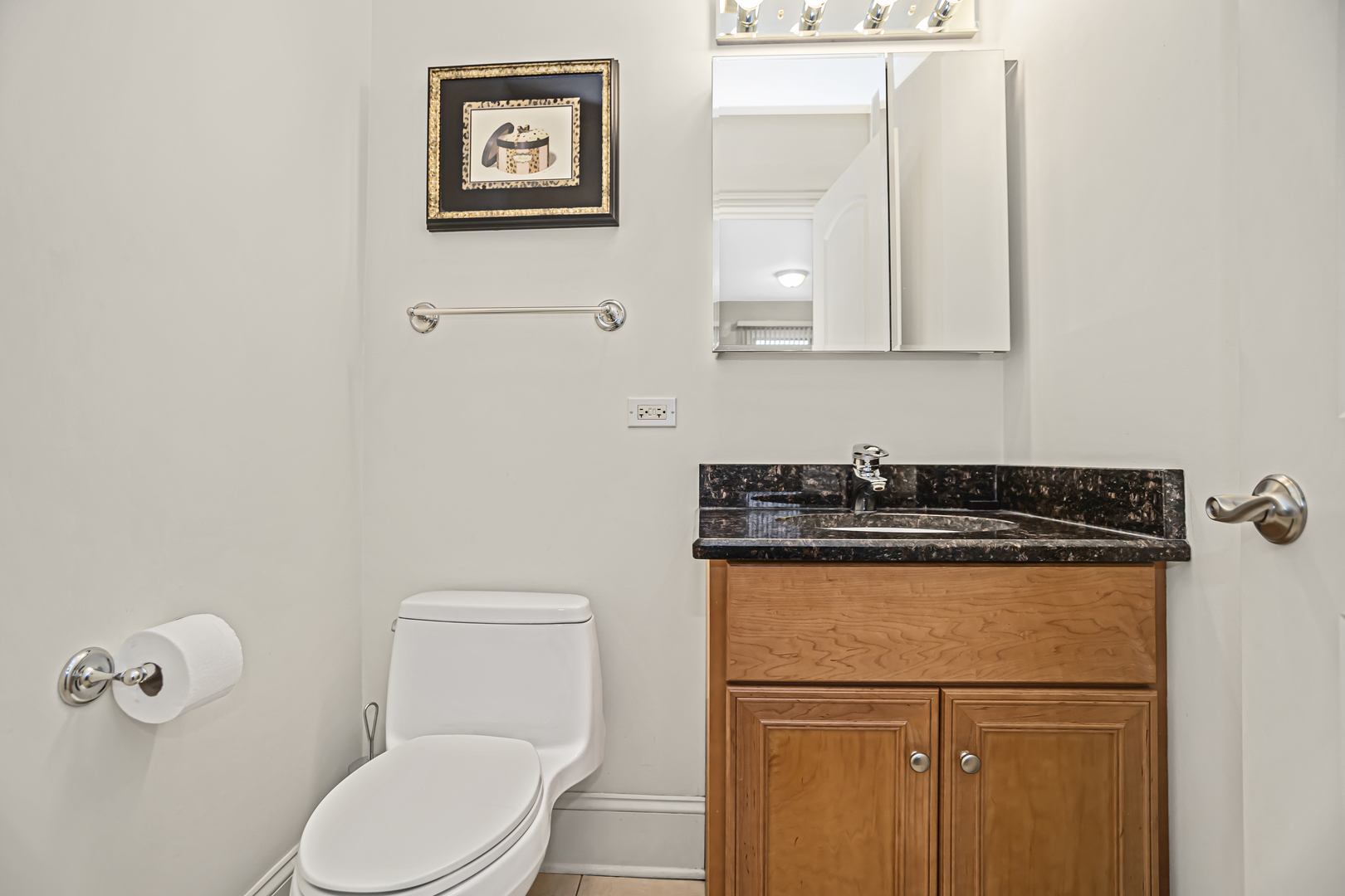 8040 West Charmaine Road Norridge, IL 60706 - Photo 22 of 62 a white toilet sitting next to a bathroom sink