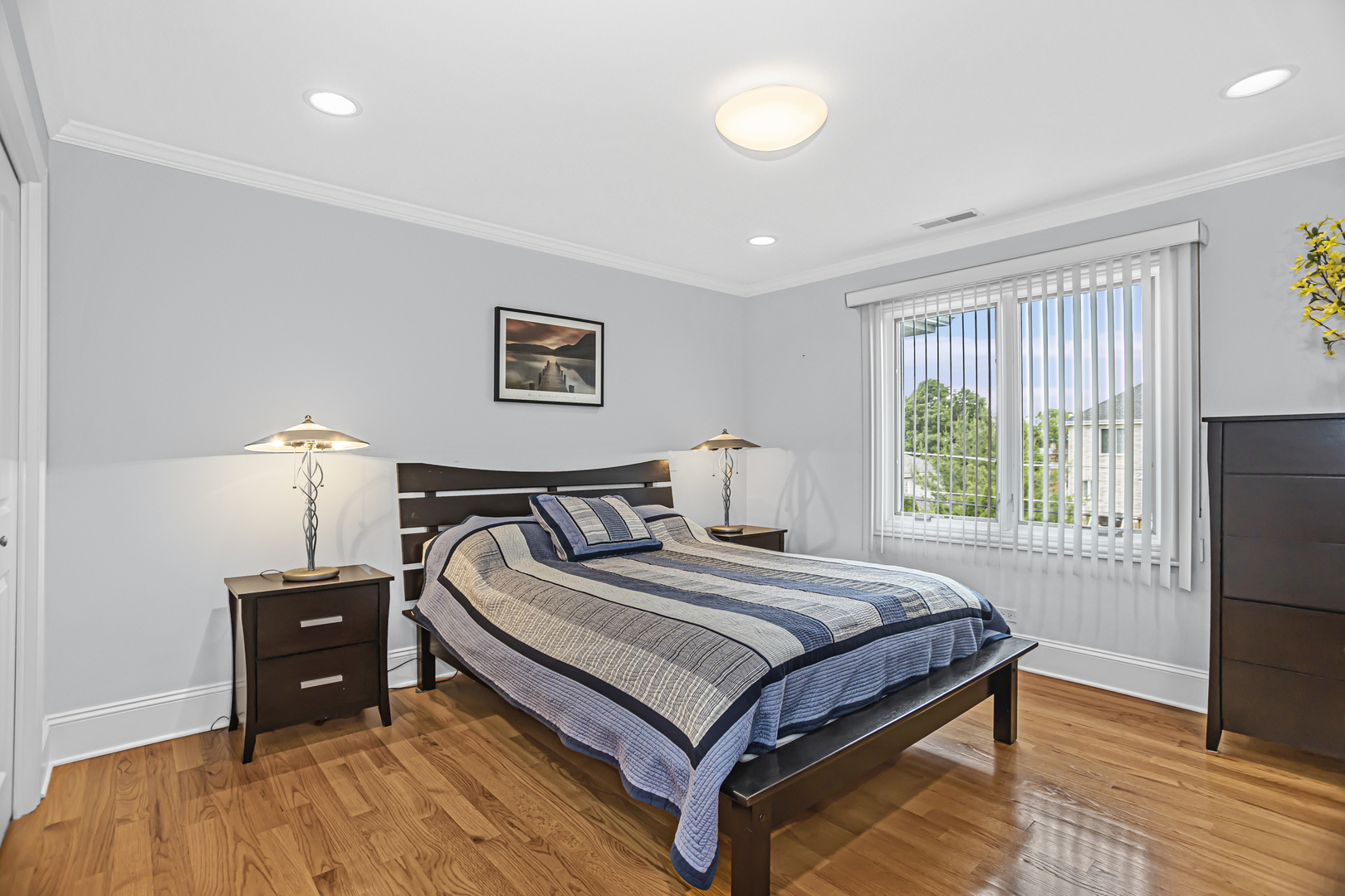 8040 West Charmaine Road Norridge, IL 60706 - Photo 35 of 62 a bedroom with a bed and a tv