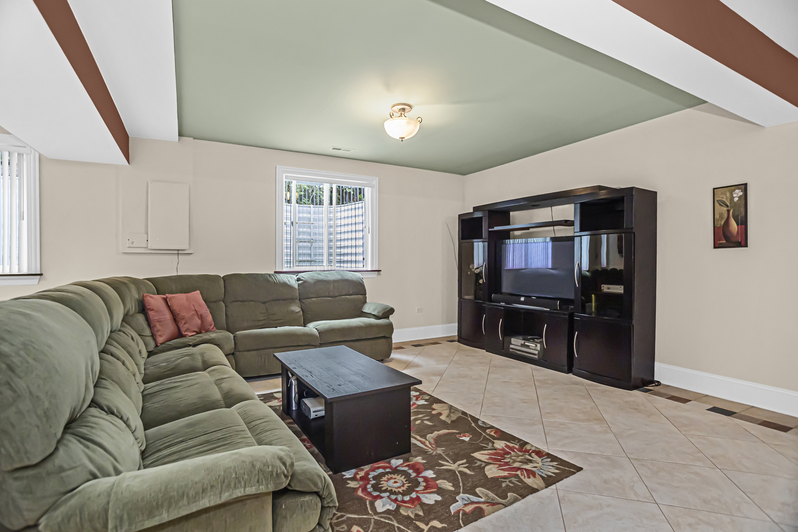 8040 West Charmaine Road Norridge, IL 60706 - Photo 46 of 62 a living room with furniture and a flat screen tv