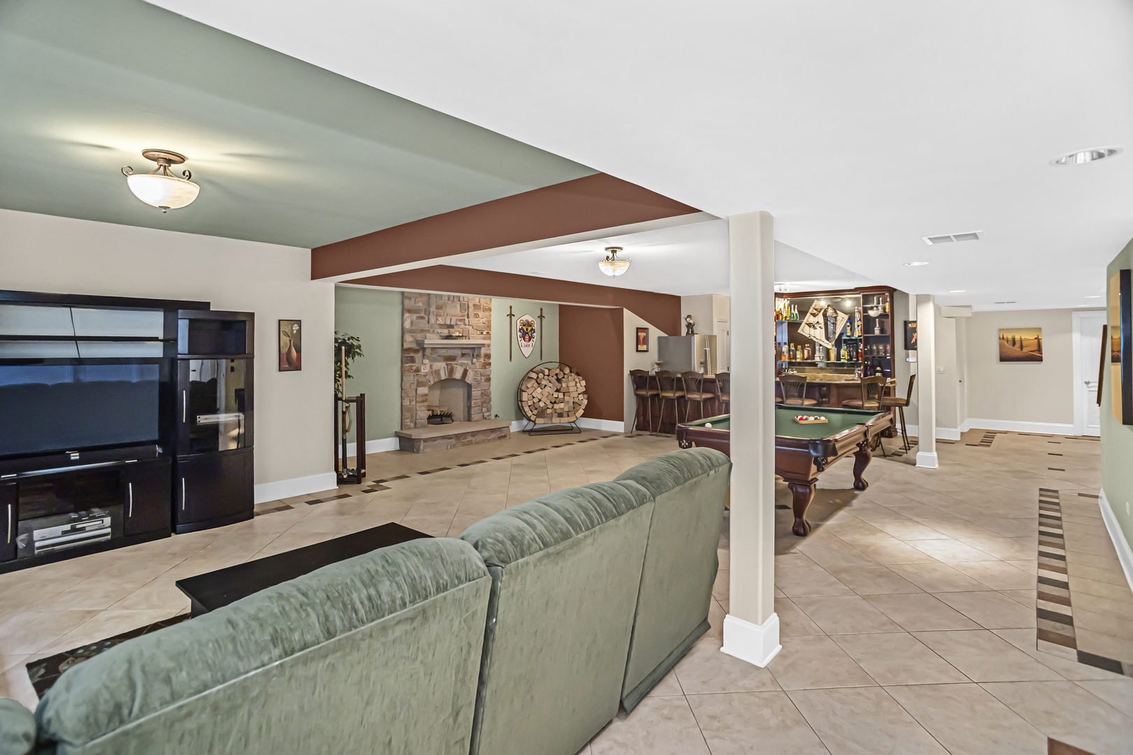 8040 West Charmaine Road Norridge, IL 60706 - Photo 47 of 62 a living room with furniture and a flat screen tv