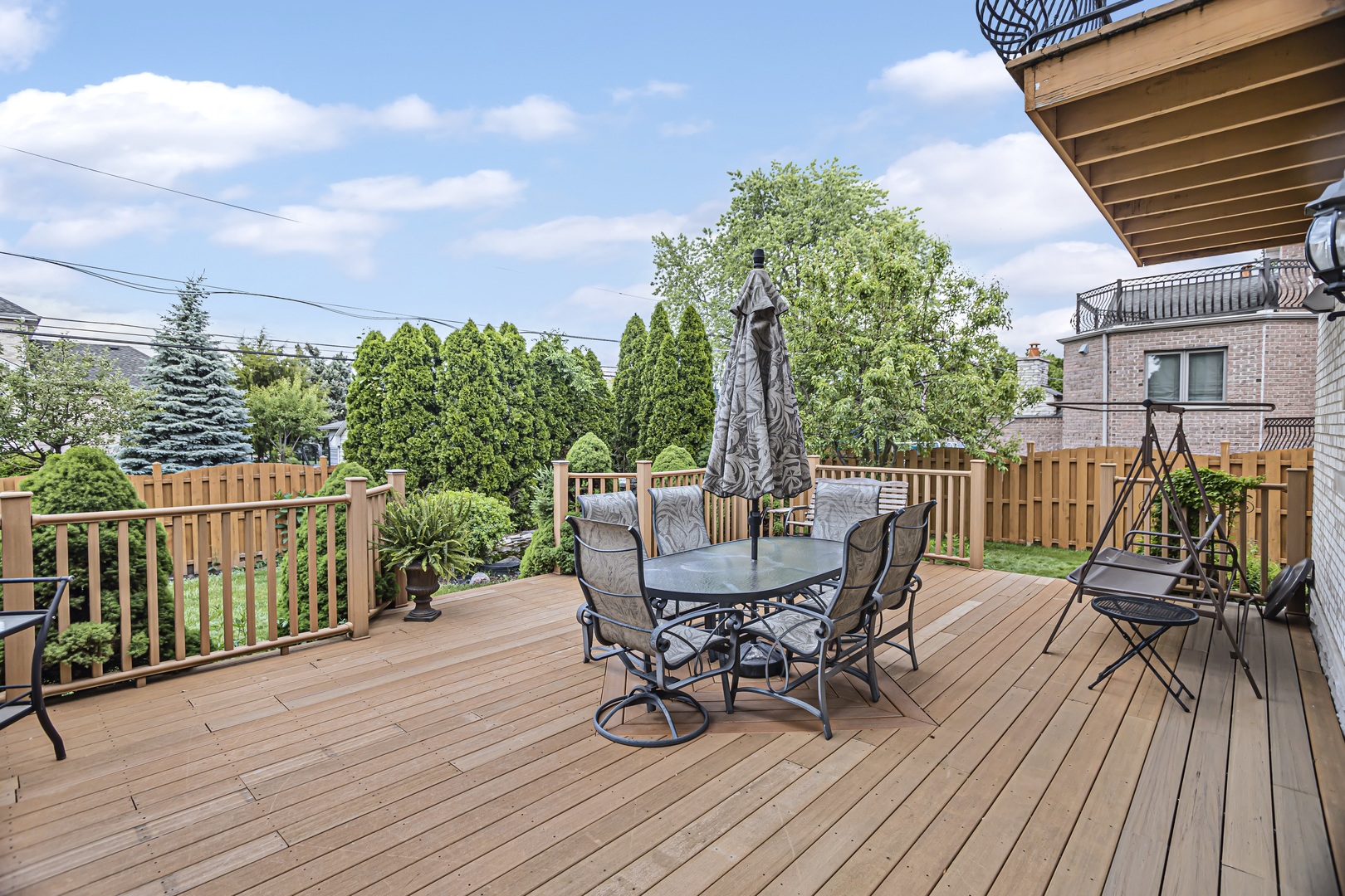 8040 West Charmaine Road Norridge, IL 60706 - Photo 53 of 62 a view of a deck with furniture and trees