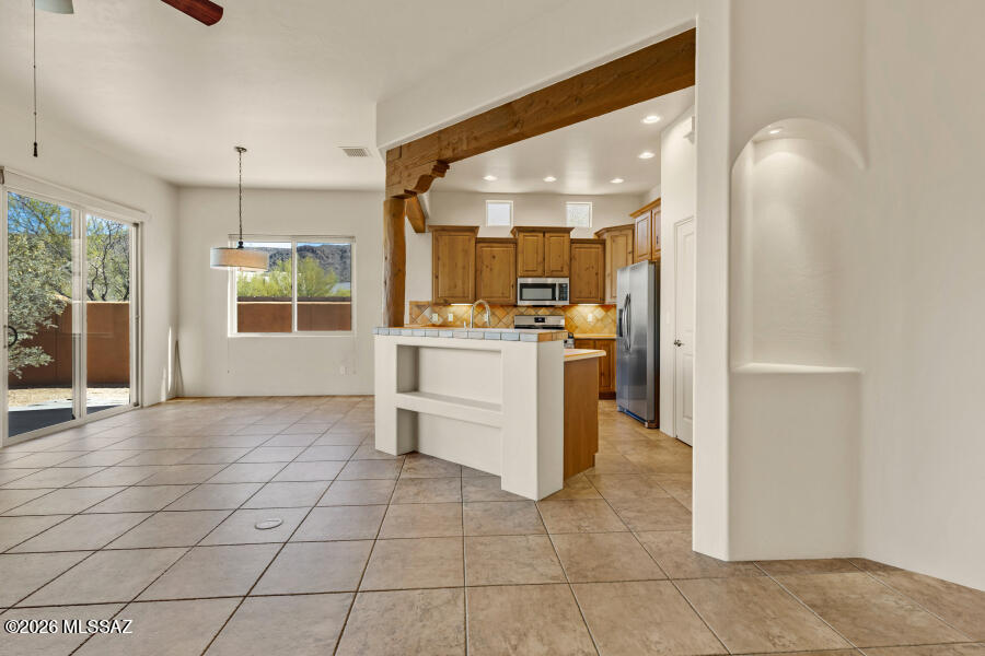 5660 Triangle X Place Tucson, AZ 85713 - Photo 14 of 48 5660 Triangle X Living Room to Kitchen