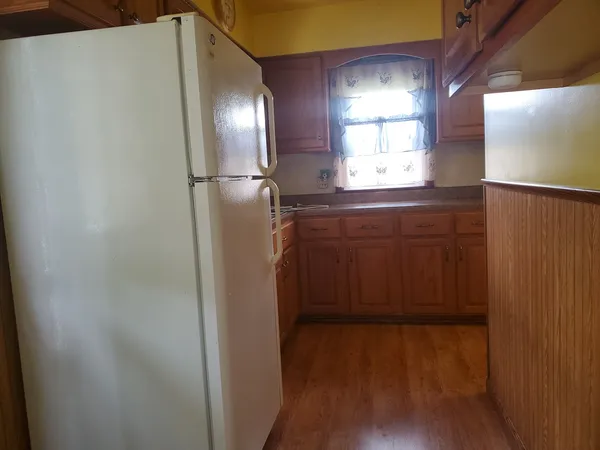 a bathroom with a double vanity and a mirror