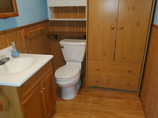 a bathroom with a toilet and a sink