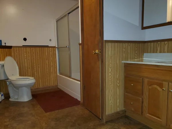 a bathroom with a toilet and a sink