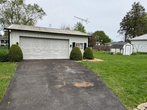 a view of a house with a back yard